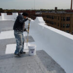 Parapet wall coated with #2000 Elastomeric Wall coating, Smooth APP coated with Lucas #608 Aluminum 2 LB Non-fibrated